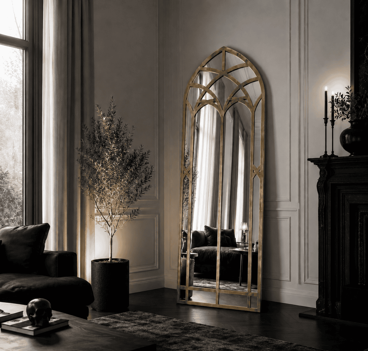 Elegant interior with a tall gold-framed mirror and classic decor at Maison Caligari.
