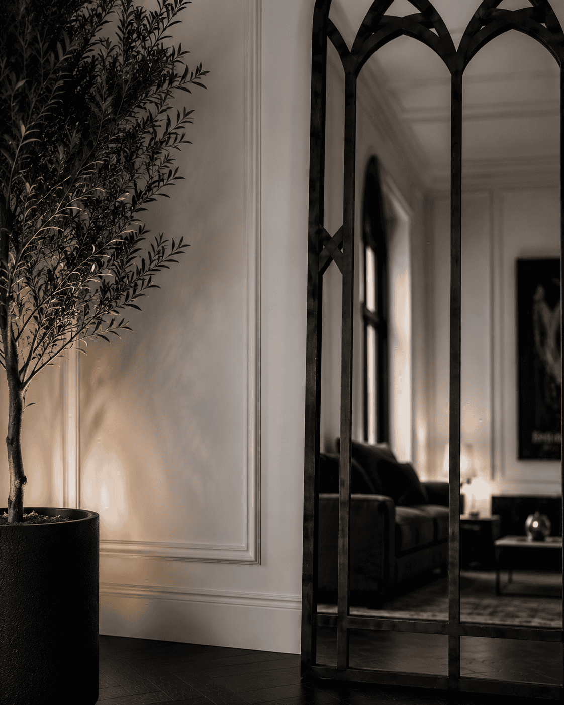 Elegant interior with a potted plant and decorative room divider at Maison Caligari.