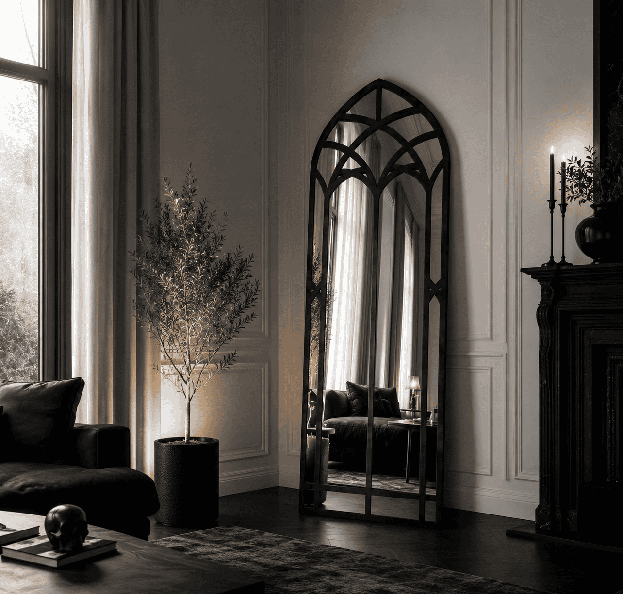 Elegant interior with a tall arched mirror and classic decor at Maison Caligari.